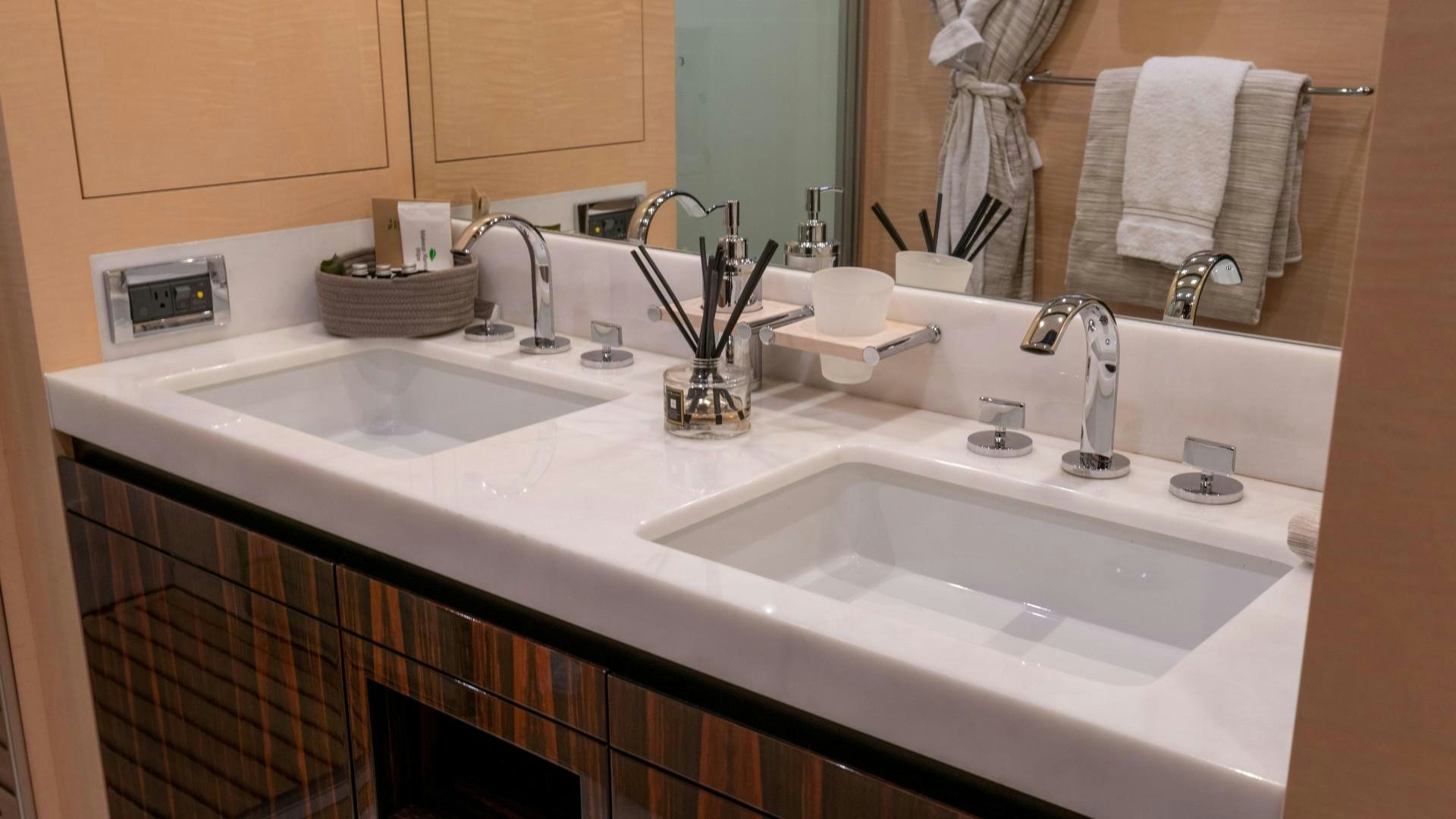 a bathroom with two sinks aboard PHOENIX Yacht for Sale