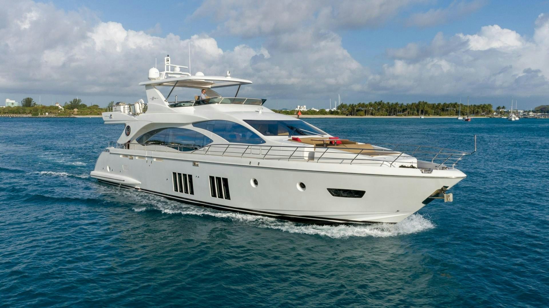 a white yacht on the water aboard PHOENIX Yacht for Sale