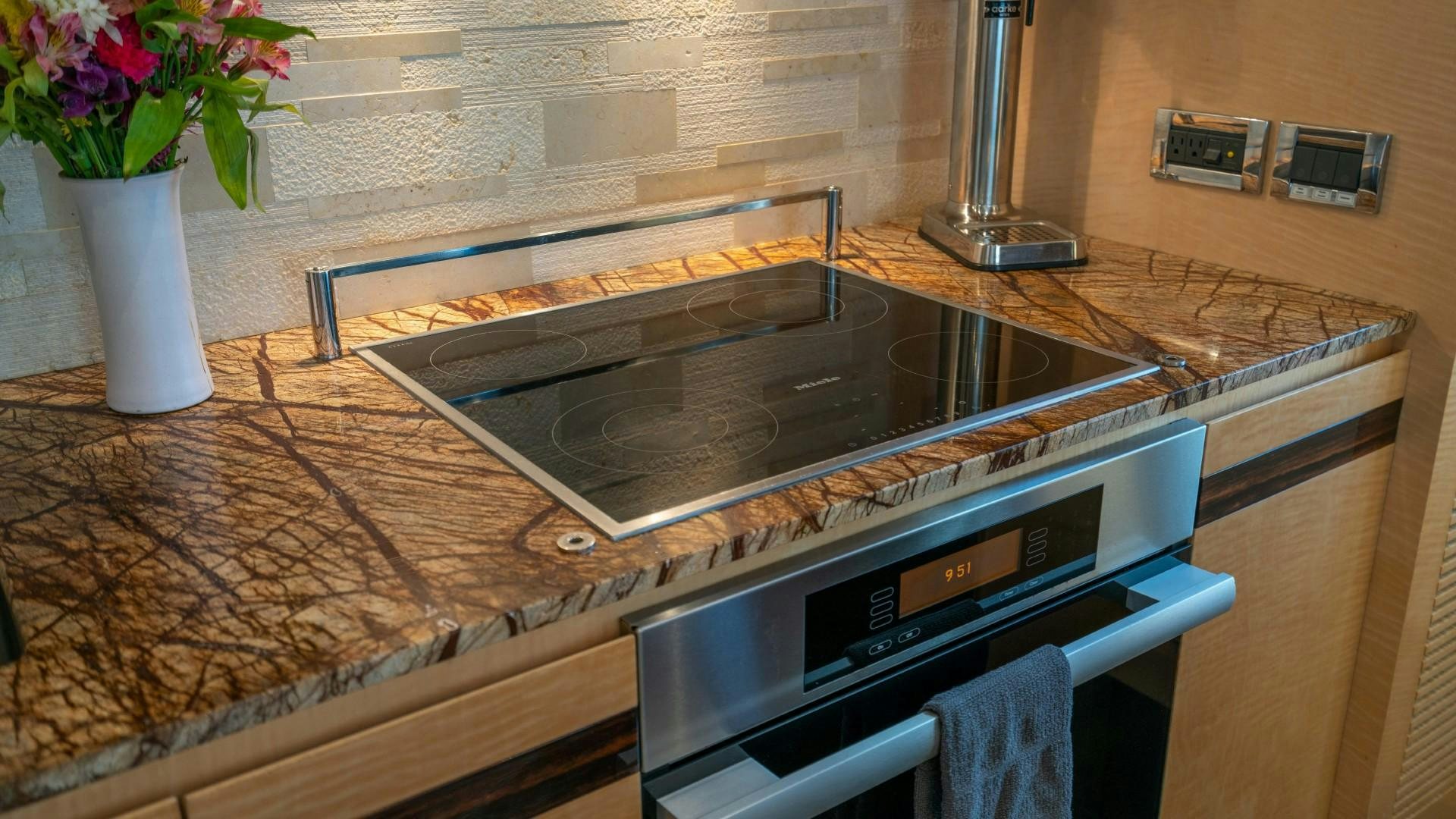 a kitchen with a stove and oven aboard PHOENIX Yacht for Sale
