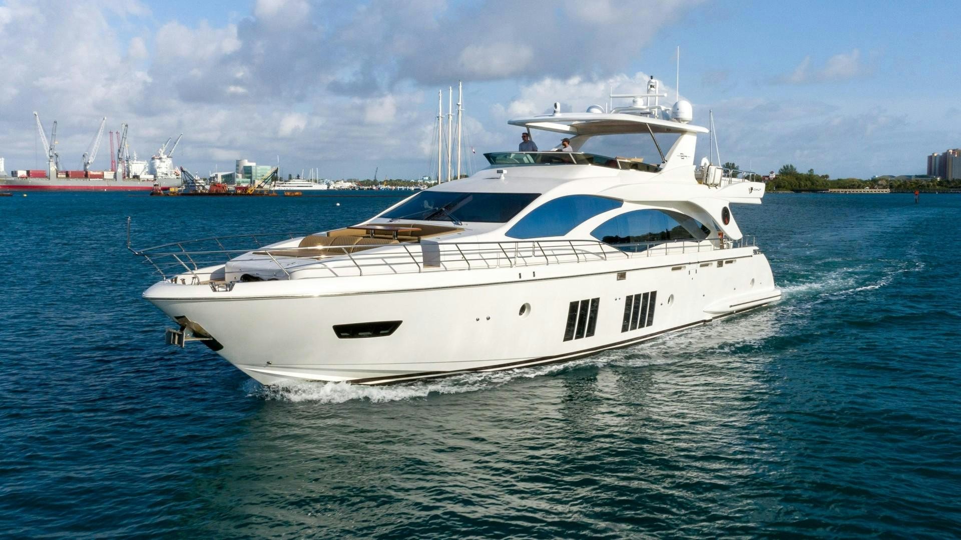 a white yacht on the water aboard PHOENIX Yacht for Sale