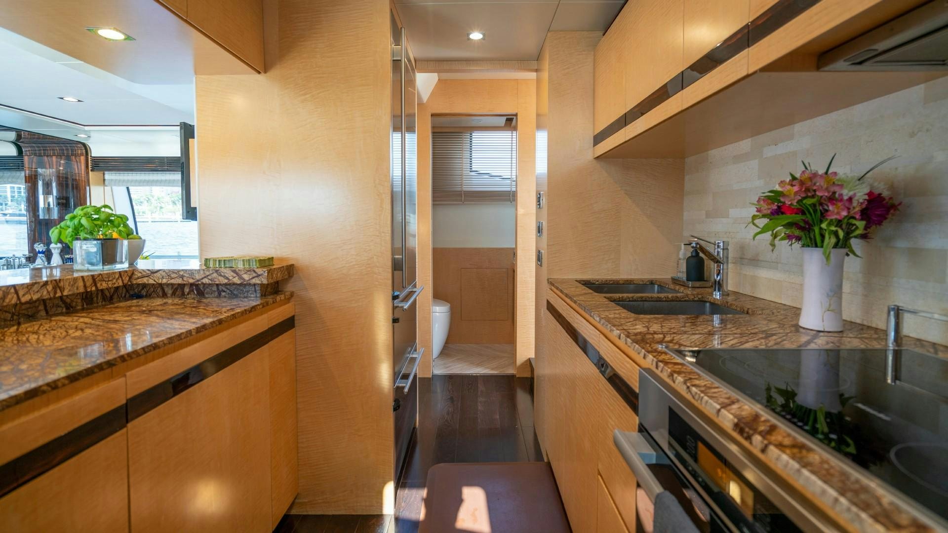 a kitchen with marble counters aboard PHOENIX Yacht for Sale