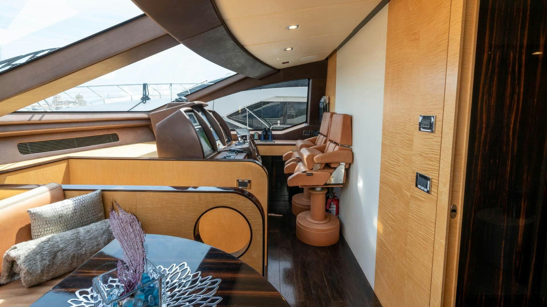 a room with a bed and a chair aboard PHOENIX Yacht for Sale