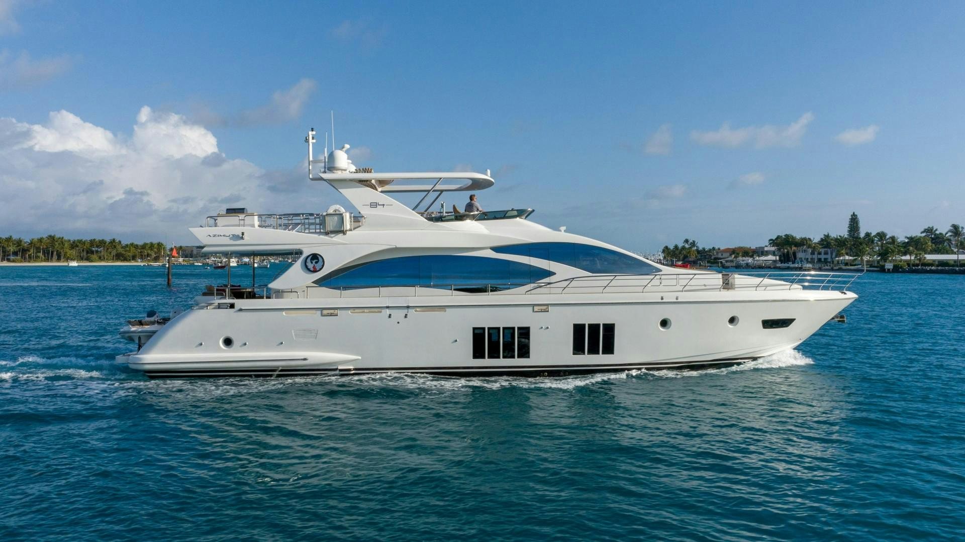 a white yacht in the water aboard PHOENIX Yacht for Sale