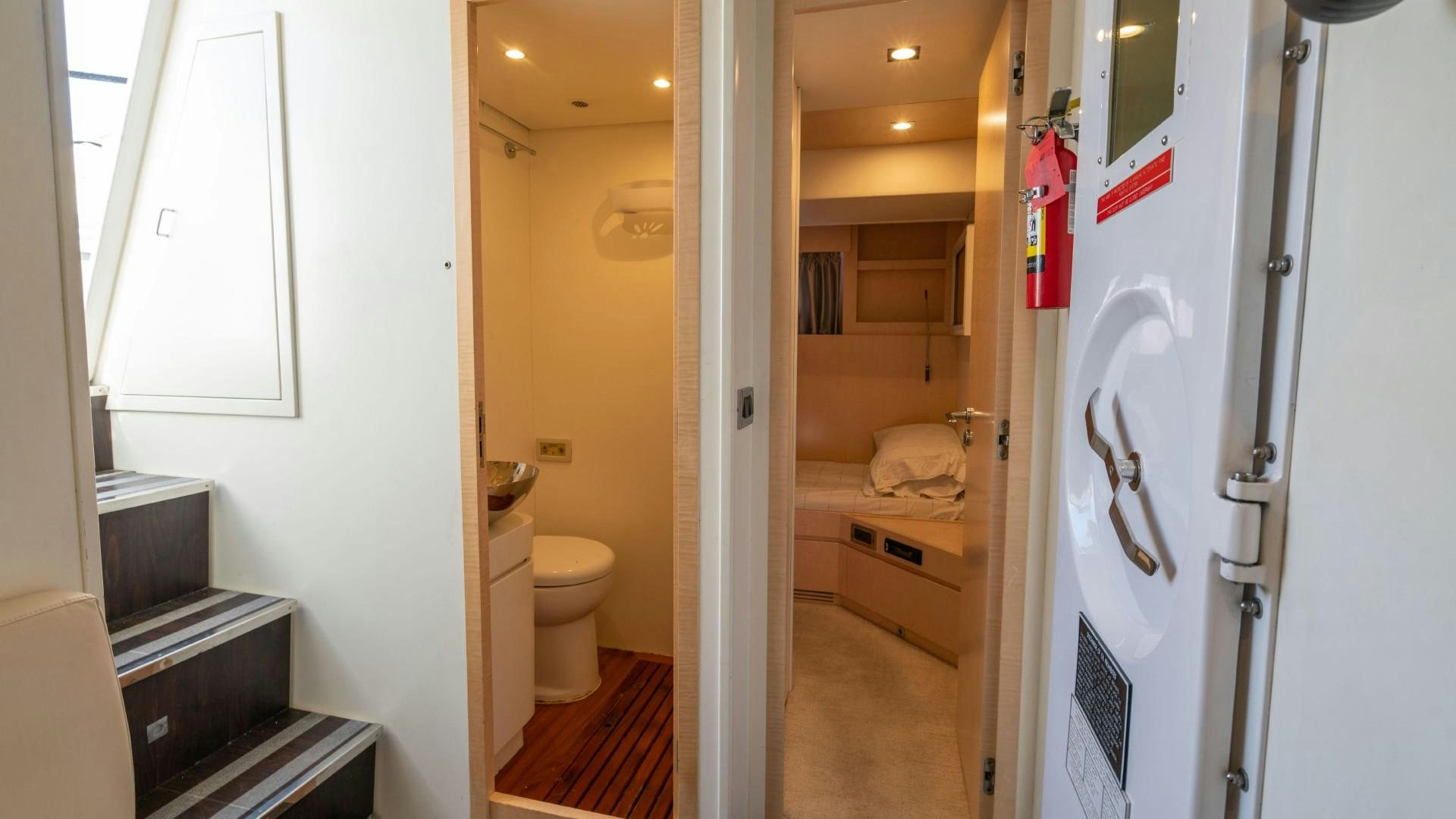 a bathroom with a toilet and a sink aboard PHOENIX Yacht for Sale