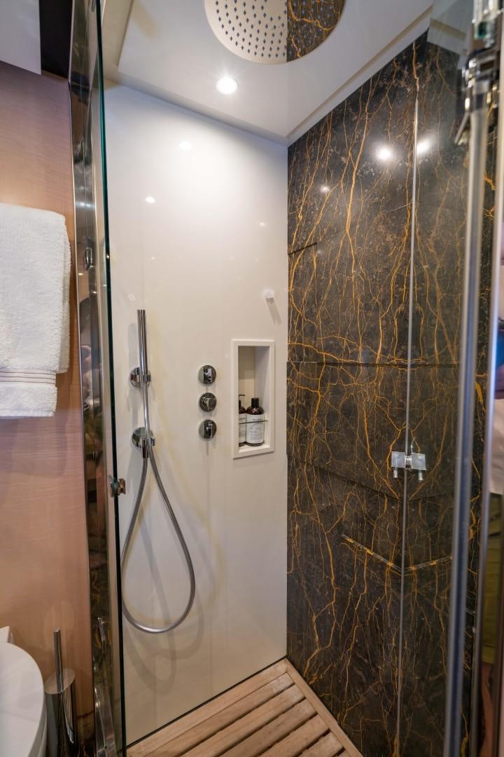 a shower with a glass door aboard PHOENIX Yacht for Sale