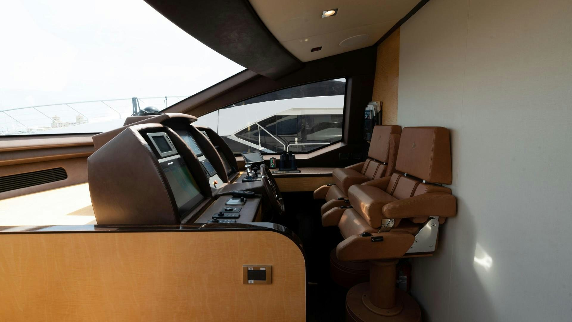 a couple of chairs and a desk in a room aboard PHOENIX Yacht for Sale