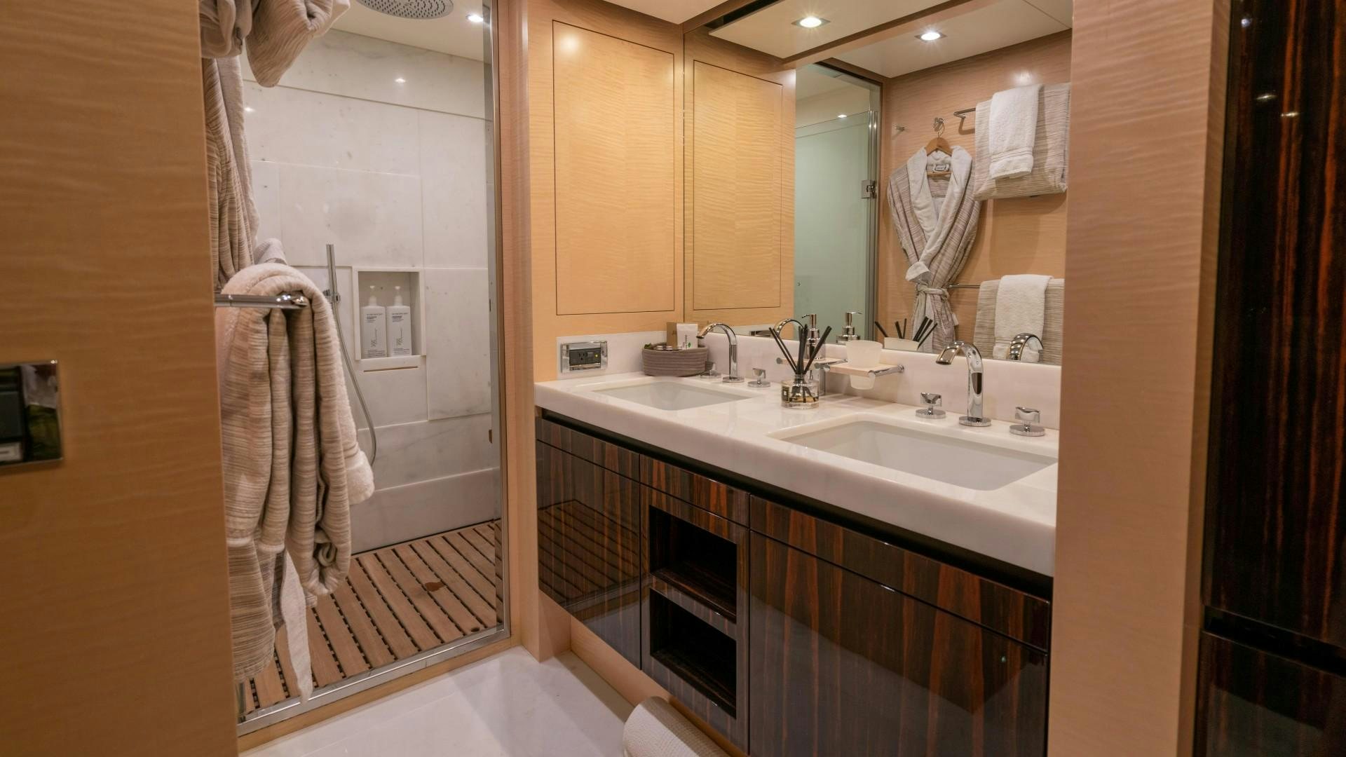 a bathroom with a large mirror aboard PHOENIX Yacht for Sale