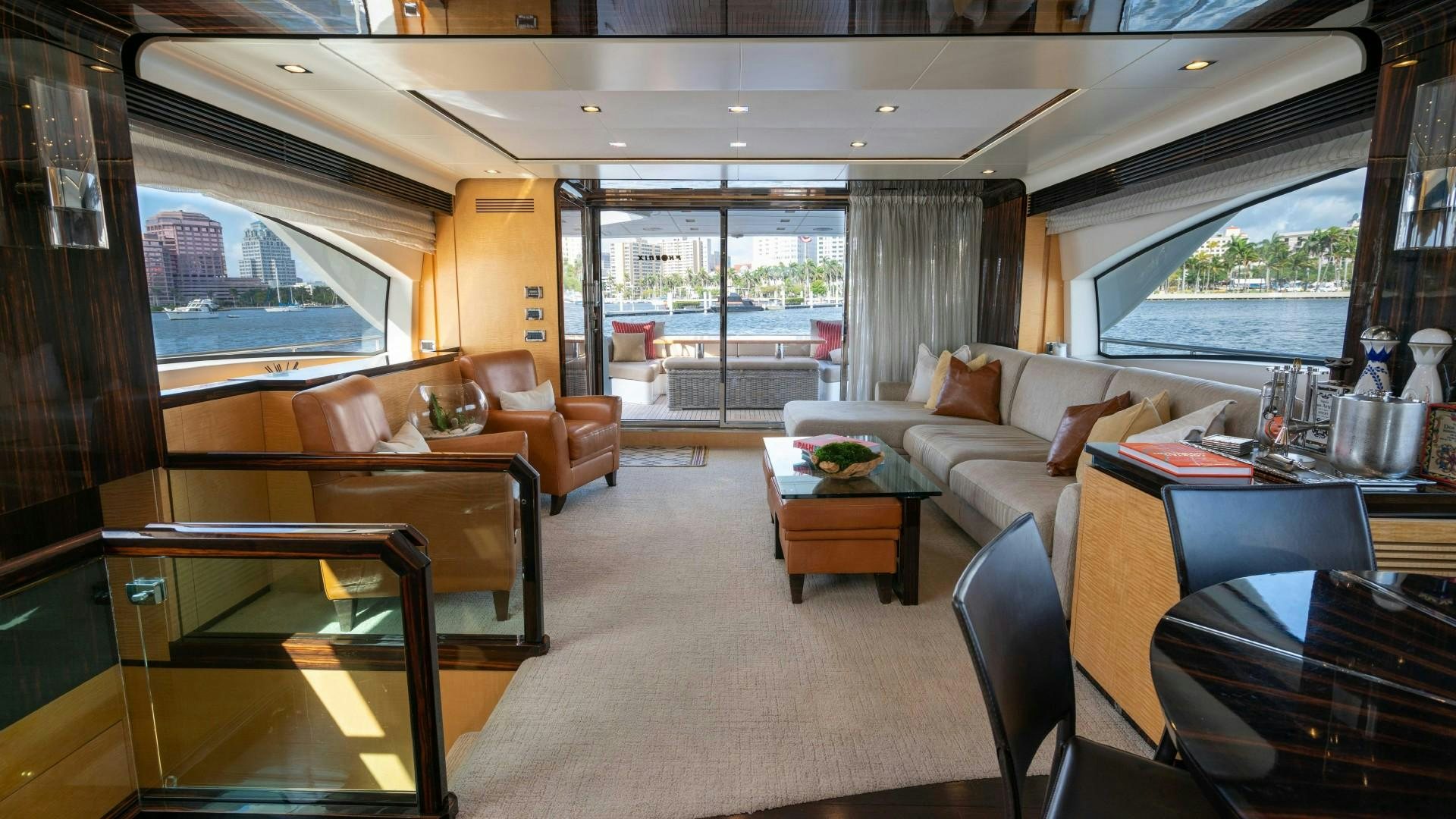 a living room with a large window aboard PHOENIX Yacht for Sale