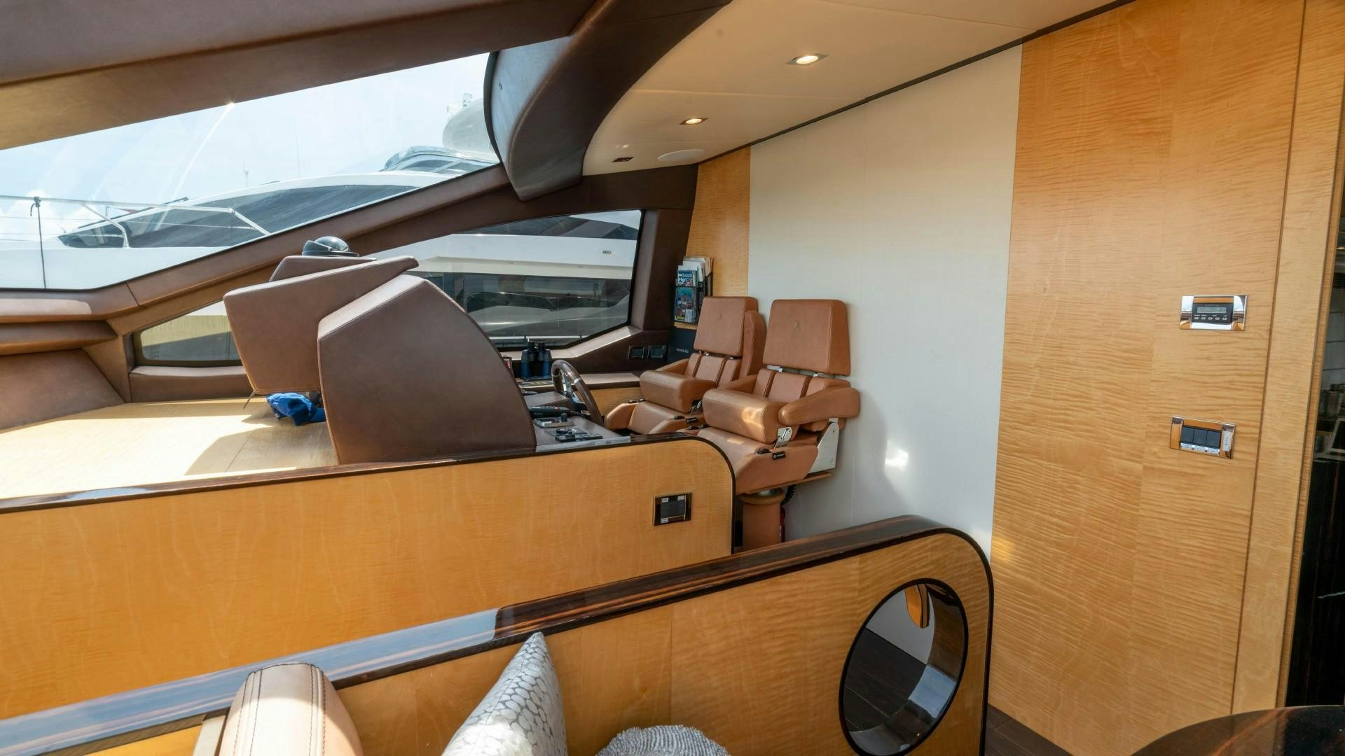 a room with a desk and chairs aboard PHOENIX Yacht for Sale