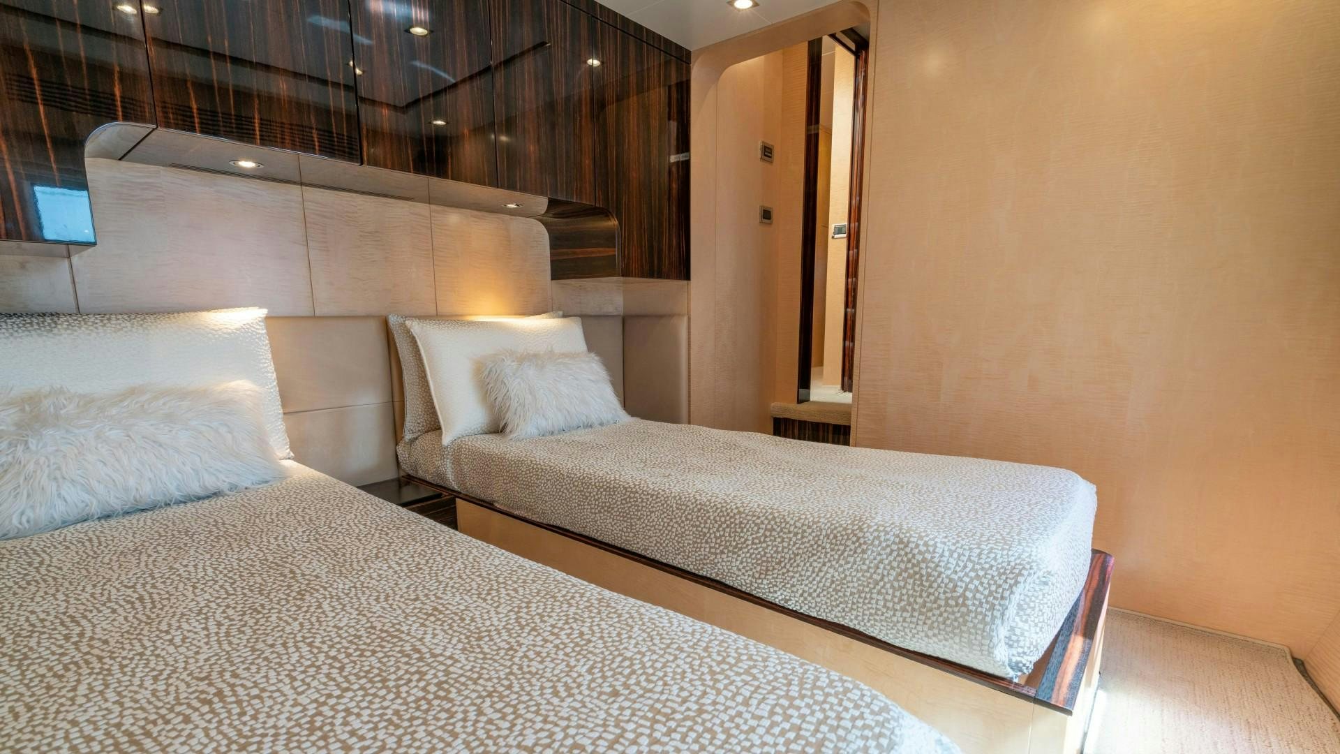 a room with two beds aboard PHOENIX Yacht for Sale