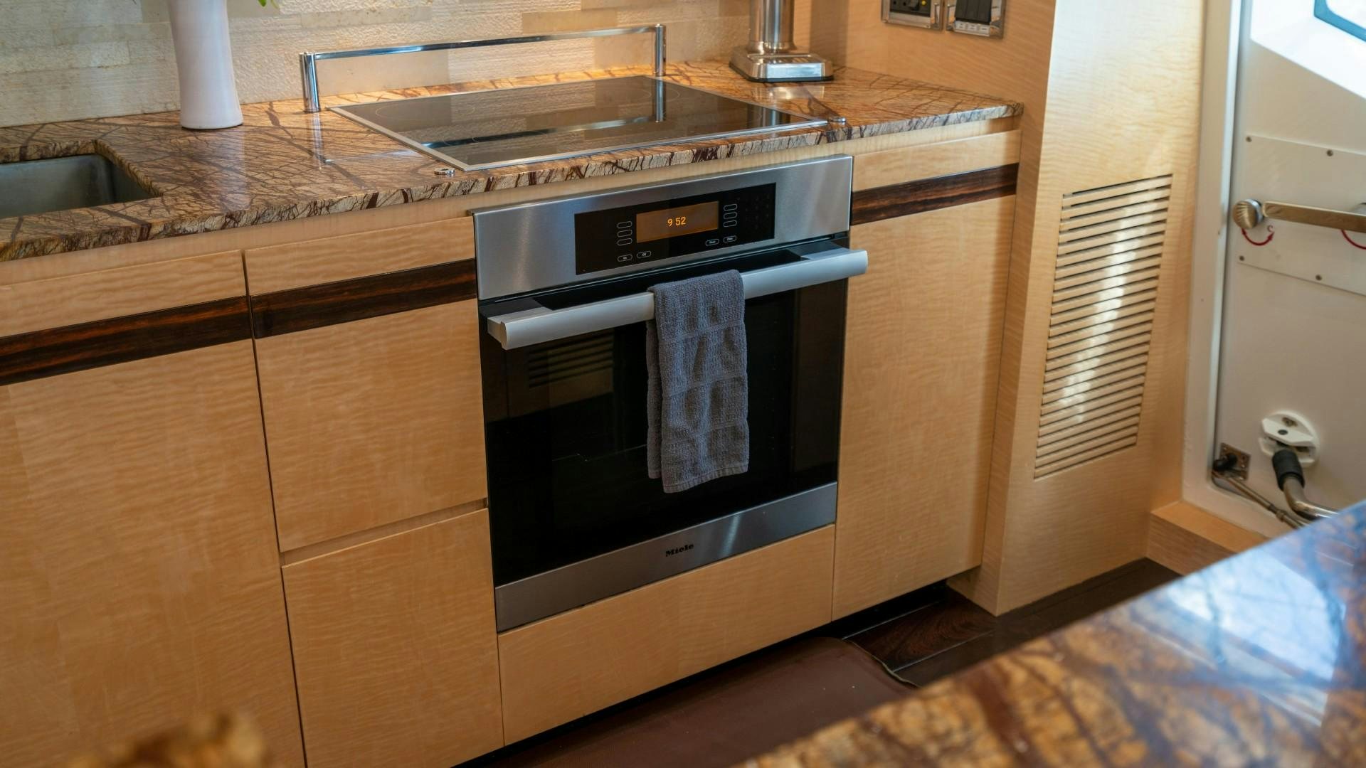 a kitchen with a stove and oven aboard PHOENIX Yacht for Sale