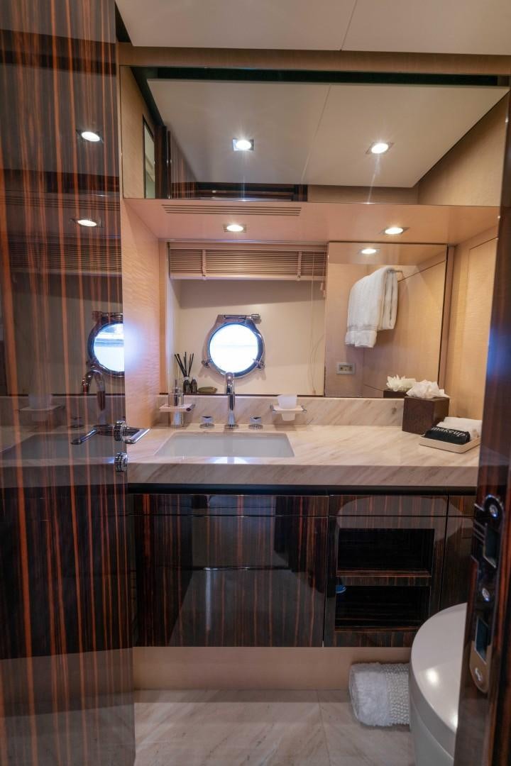 a bathroom with a large mirror aboard PHOENIX Yacht for Sale