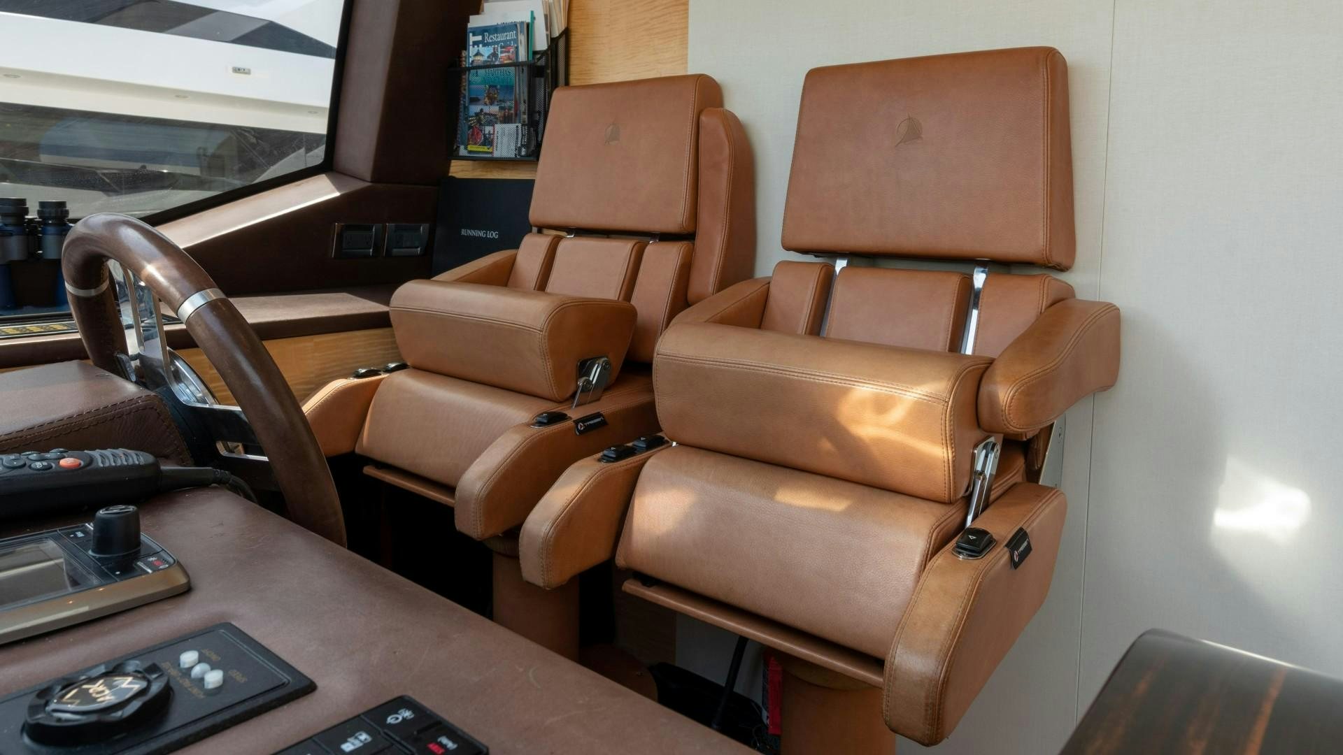 a leather chair in a car aboard PHOENIX Yacht for Sale