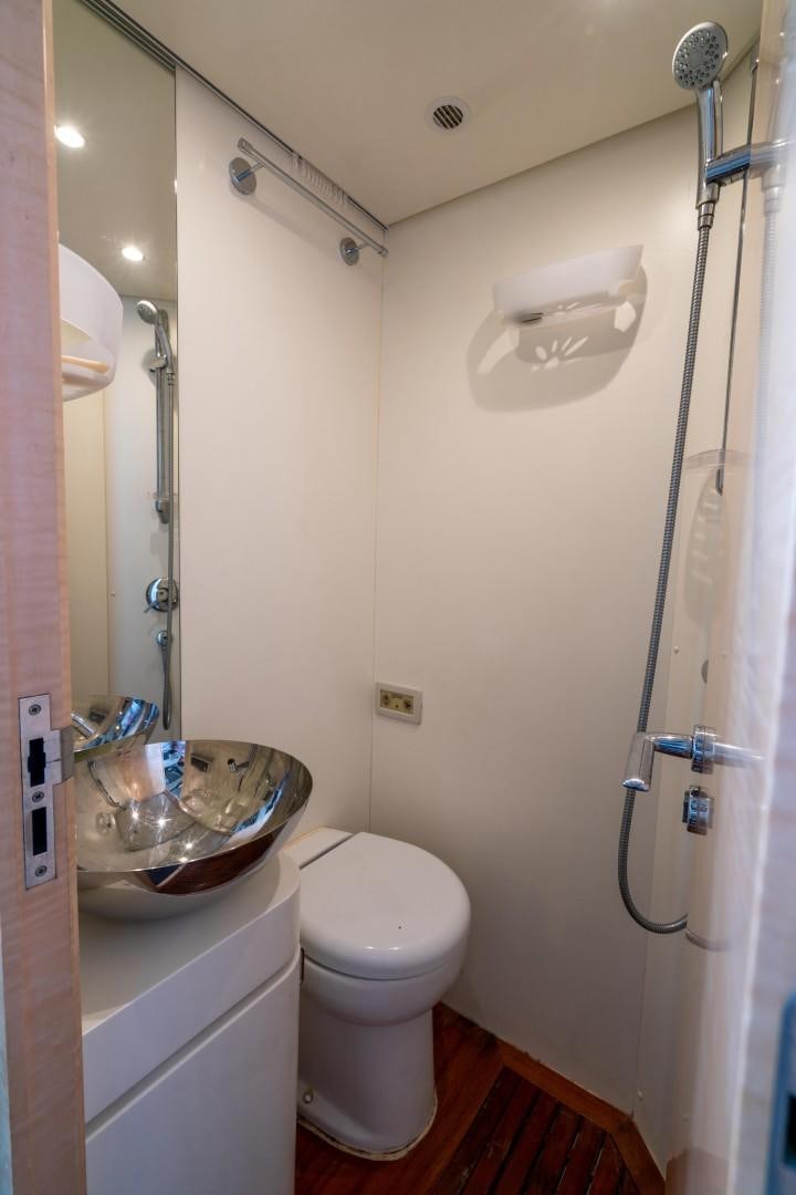 a bathroom with a sink and a toilet aboard PHOENIX Yacht for Sale
