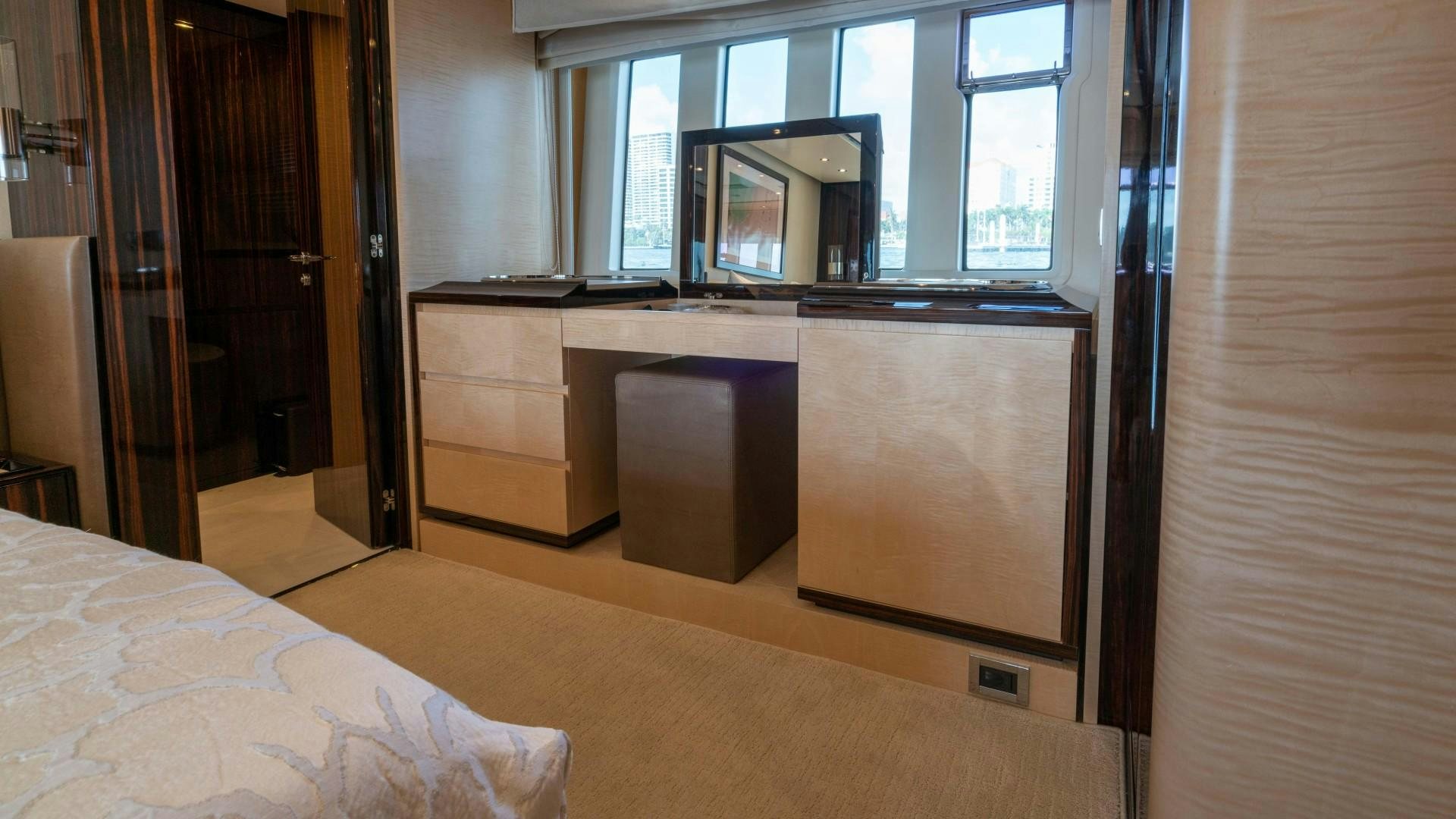 a room with a bed and a desk aboard PHOENIX Yacht for Sale