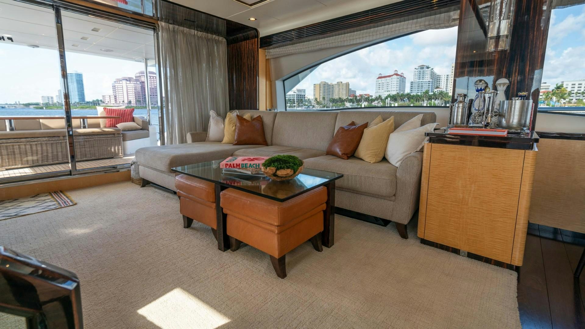 a living room with a couch and a coffee table aboard PHOENIX Yacht for Sale