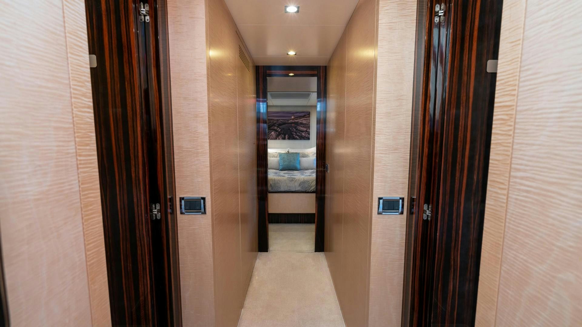 a hallway with doors aboard PHOENIX Yacht for Sale