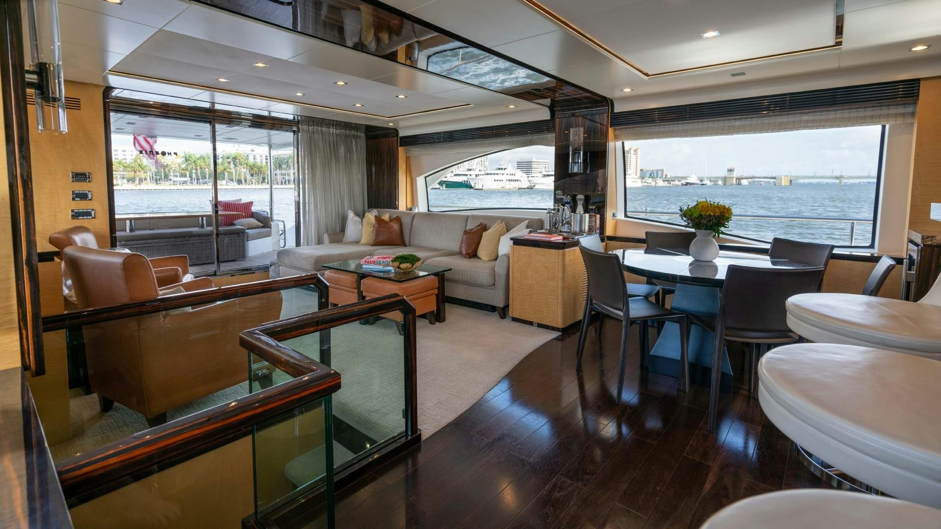 a living room with a large window aboard PHOENIX Yacht for Sale