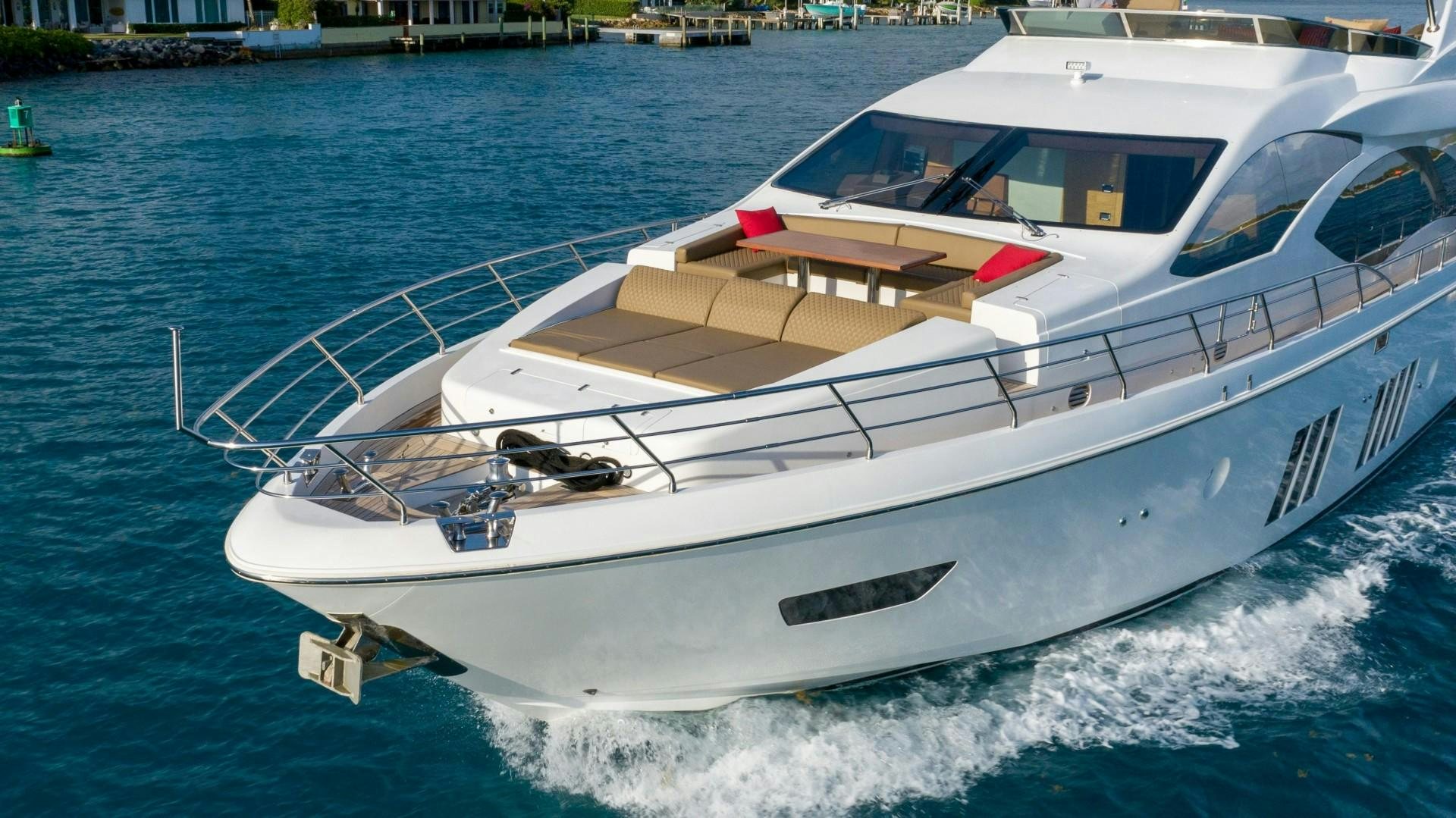 a white boat on the water aboard PHOENIX Yacht for Sale