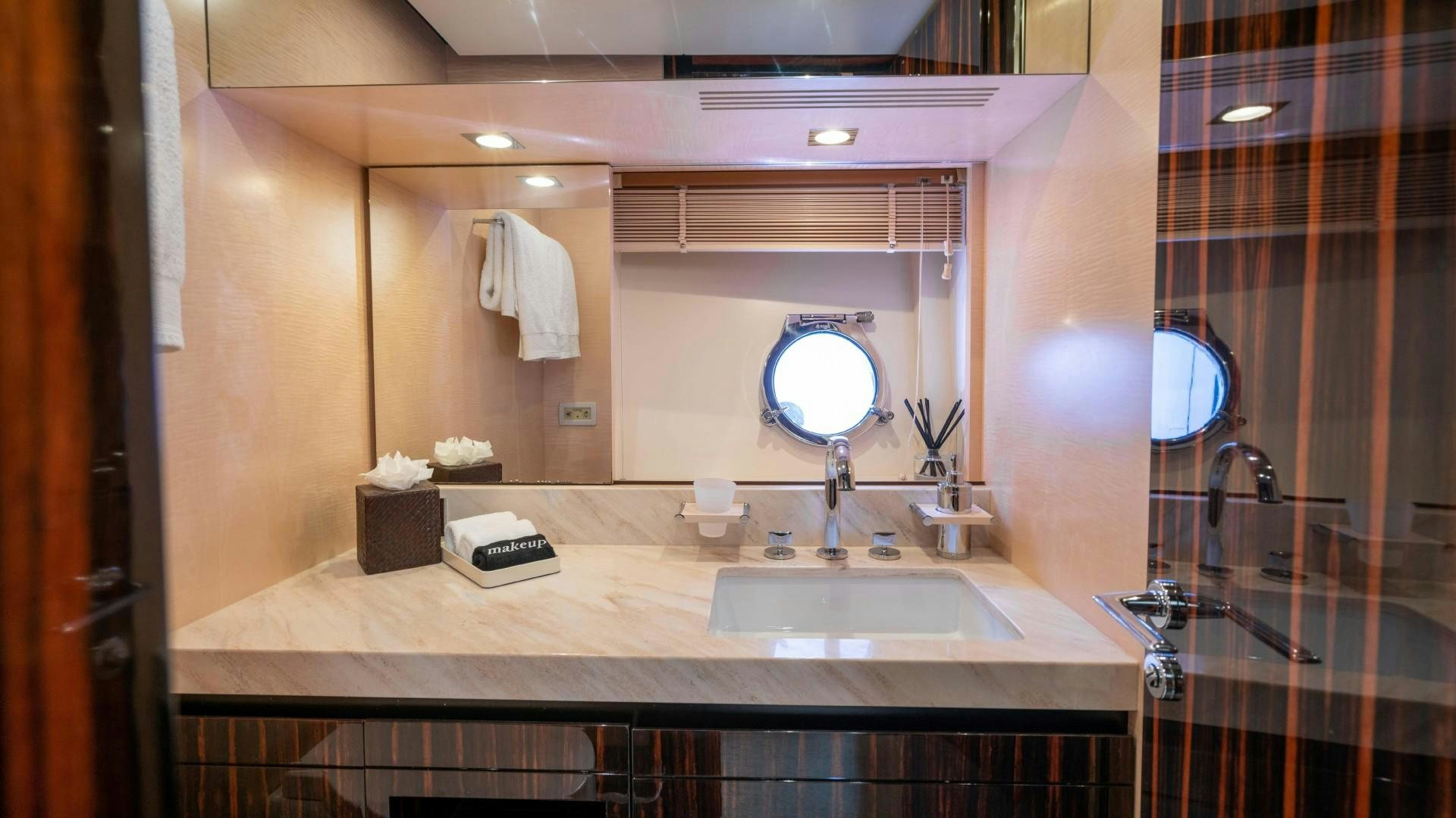 a bathroom with a large mirror aboard PHOENIX Yacht for Sale