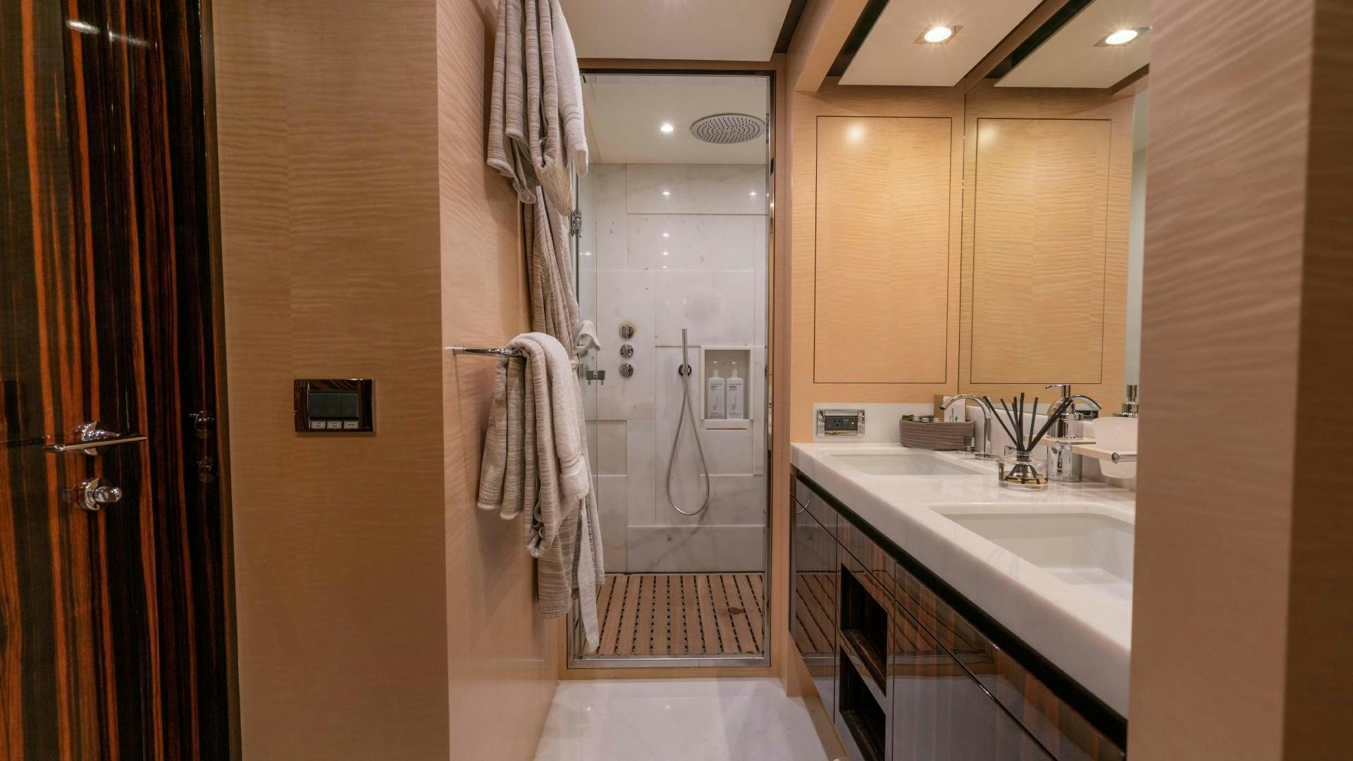 a bathroom with a sink and a shower aboard PHOENIX Yacht for Sale