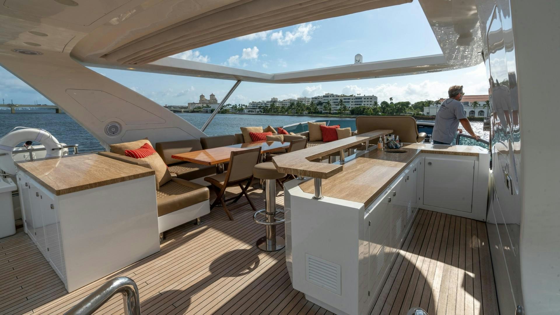 a room with a couch and a table aboard PHOENIX Yacht for Sale