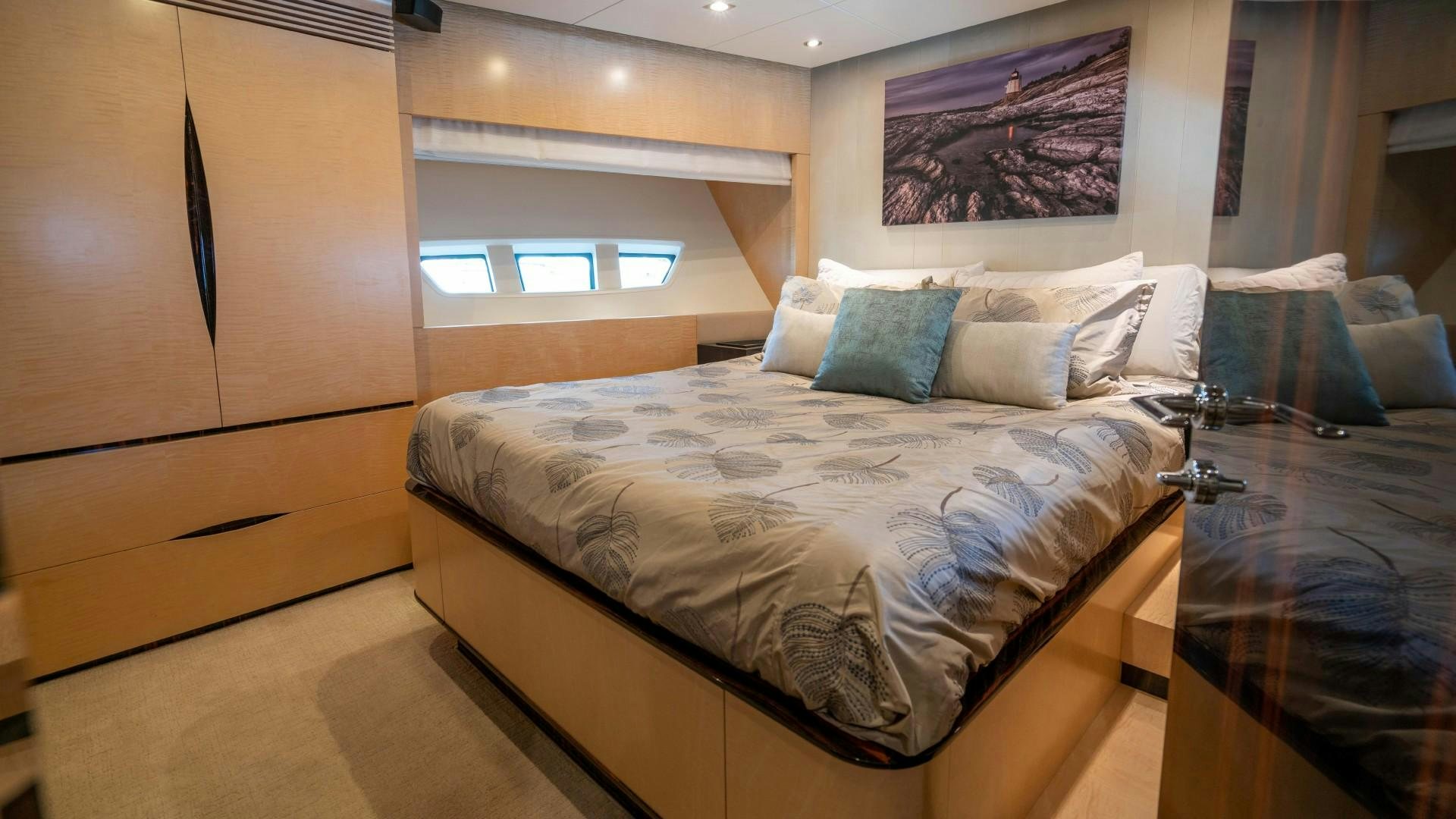 a room with a bed and a window aboard PHOENIX Yacht for Sale