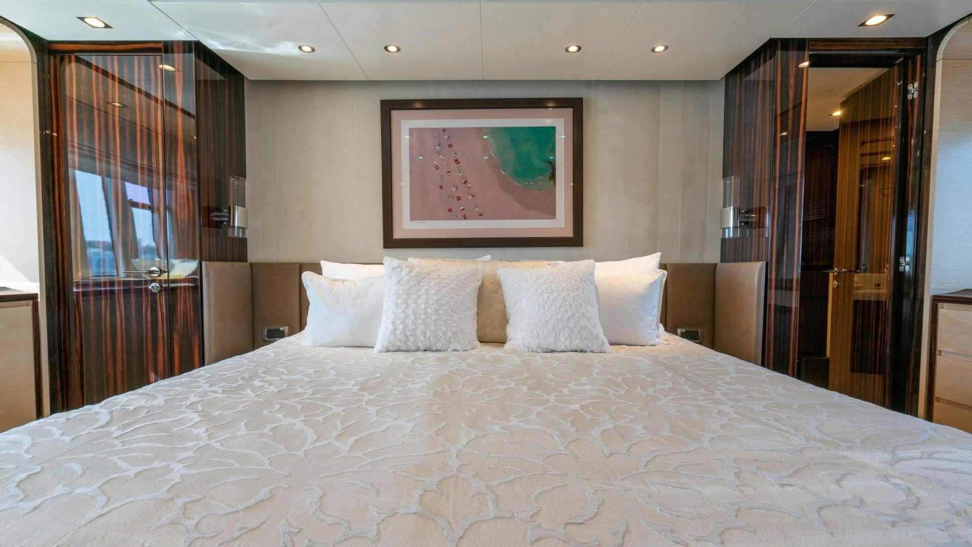 a bed with pillows aboard PHOENIX Yacht for Sale