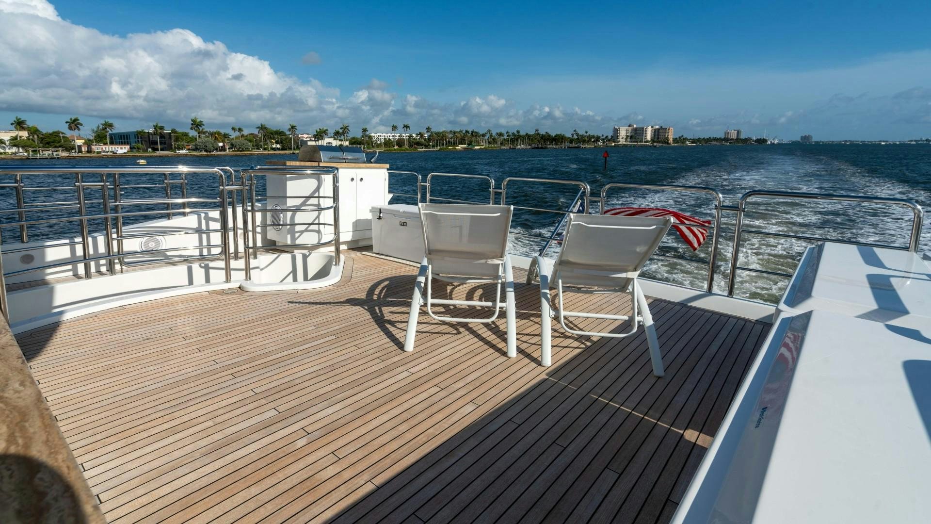 a deck with chairs on it aboard PHOENIX Yacht for Sale