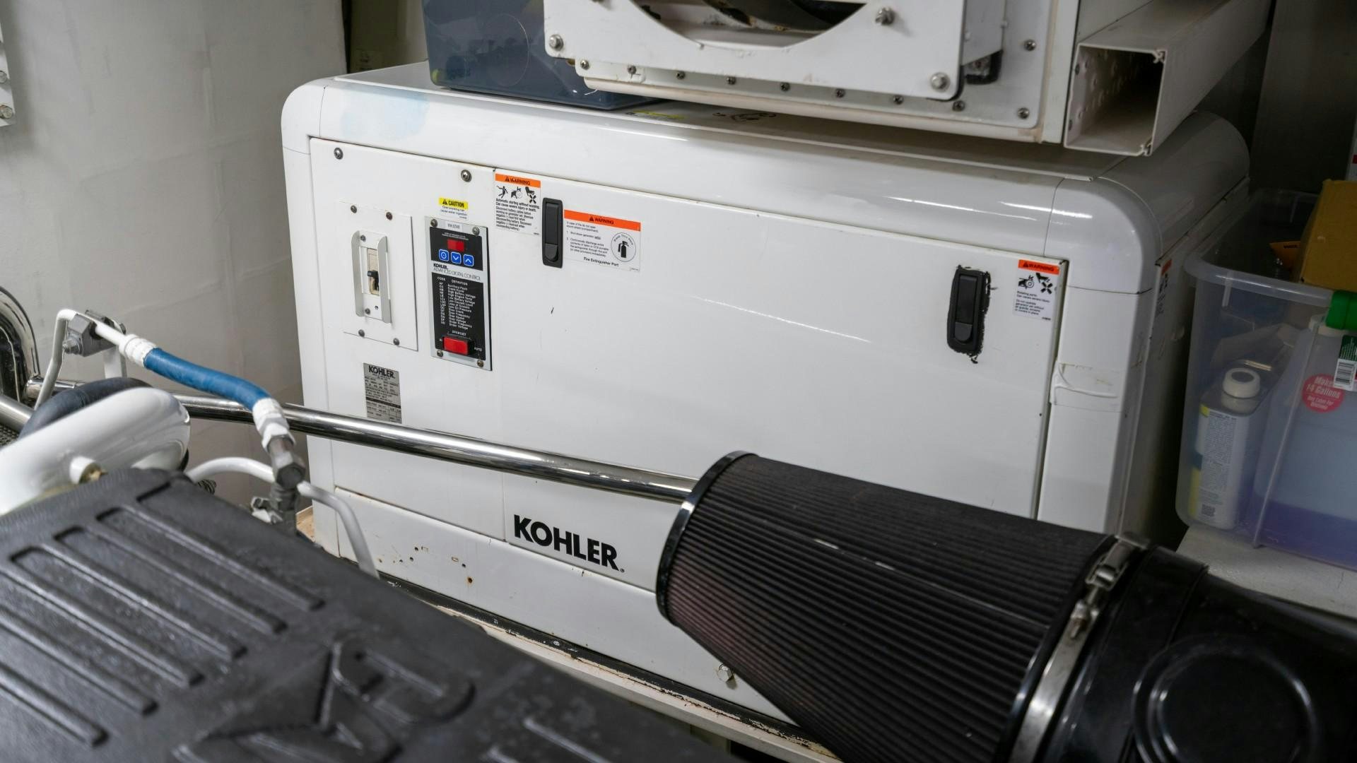 a white machine with a blue cable aboard PHOENIX Yacht for Sale