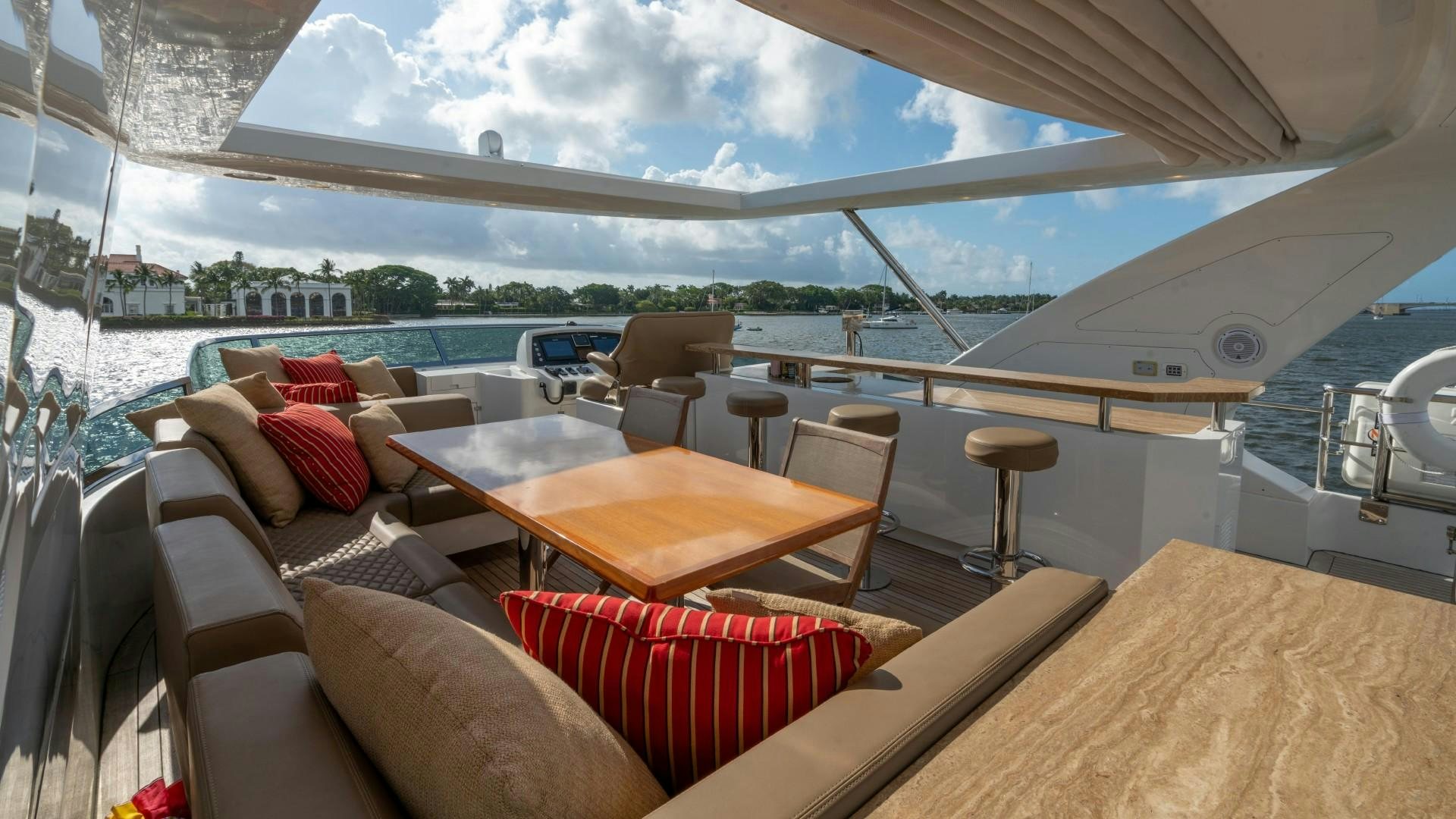 a room with a couch and a table and chairs aboard PHOENIX Yacht for Sale