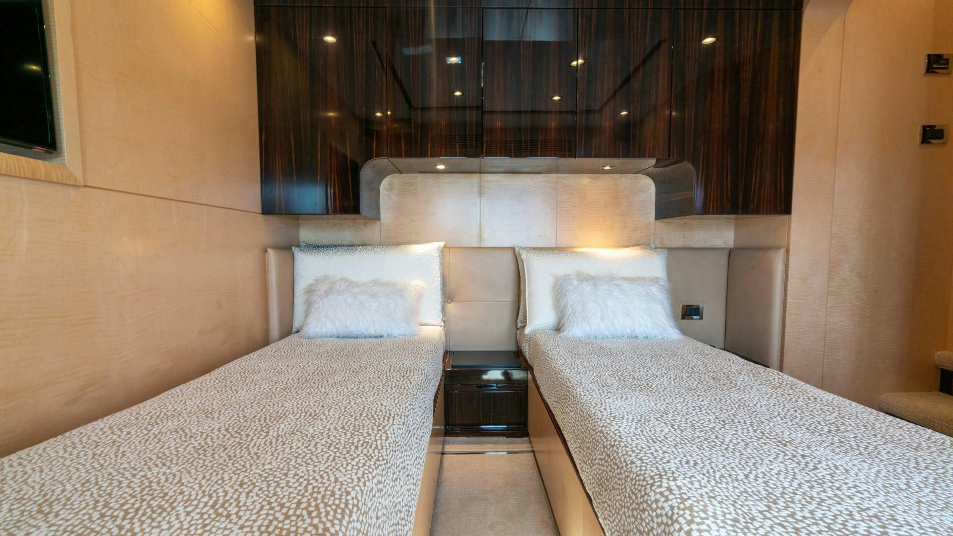 a room with a bed and a chair aboard PHOENIX Yacht for Sale