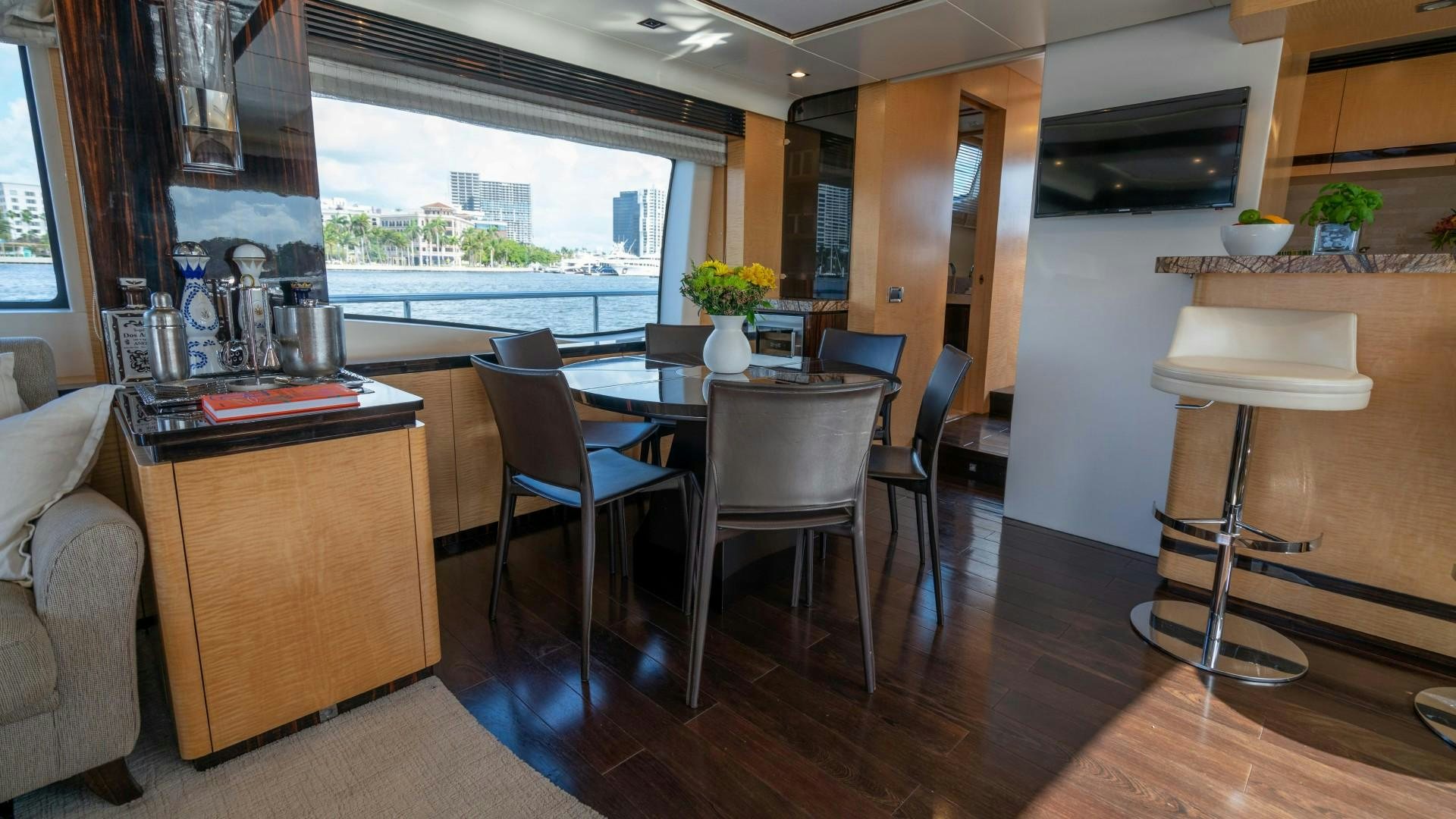 a room with a table and chairs aboard PHOENIX Yacht for Sale