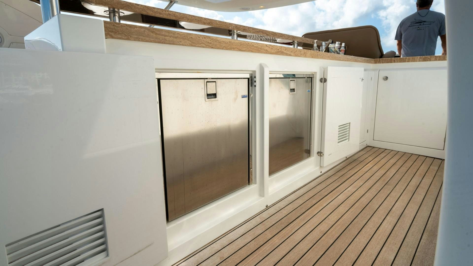 a room with a large mirror and a wood floor aboard PHOENIX Yacht for Sale