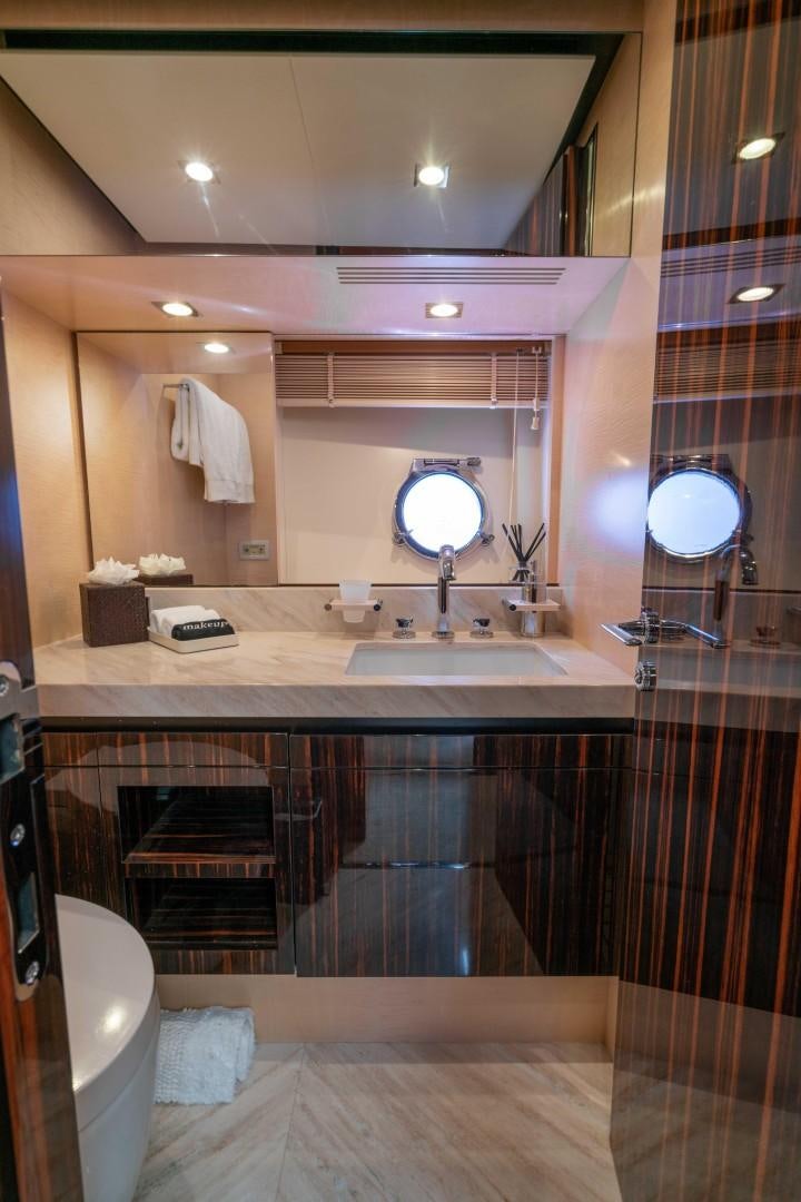 a bathroom with a large mirror aboard PHOENIX Yacht for Sale
