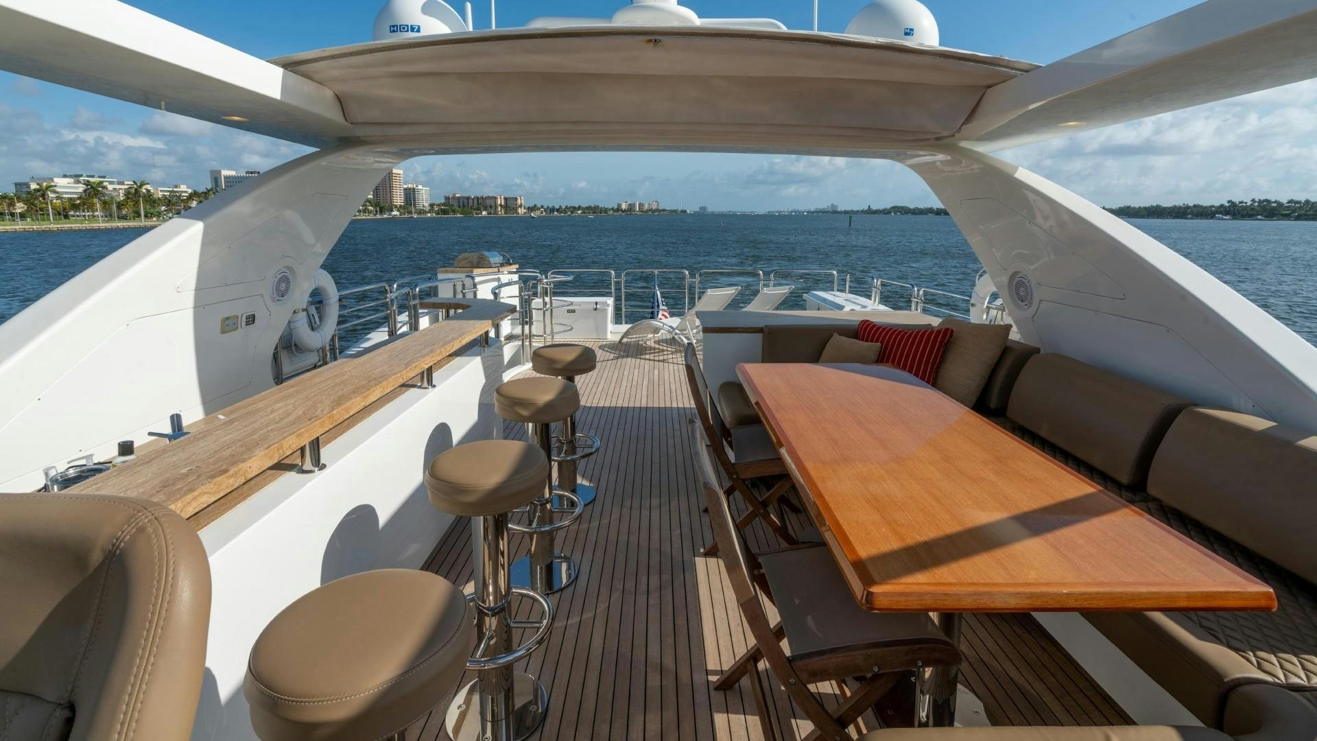 a deck with a view of the ocean and the land below aboard PHOENIX Yacht for Sale