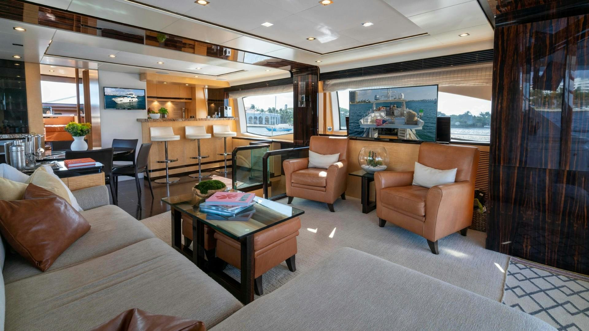 a living room with a large window aboard PHOENIX Yacht for Sale