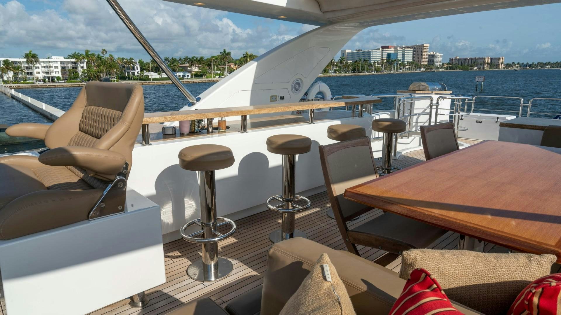 a table and chairs on a boat aboard PHOENIX Yacht for Sale