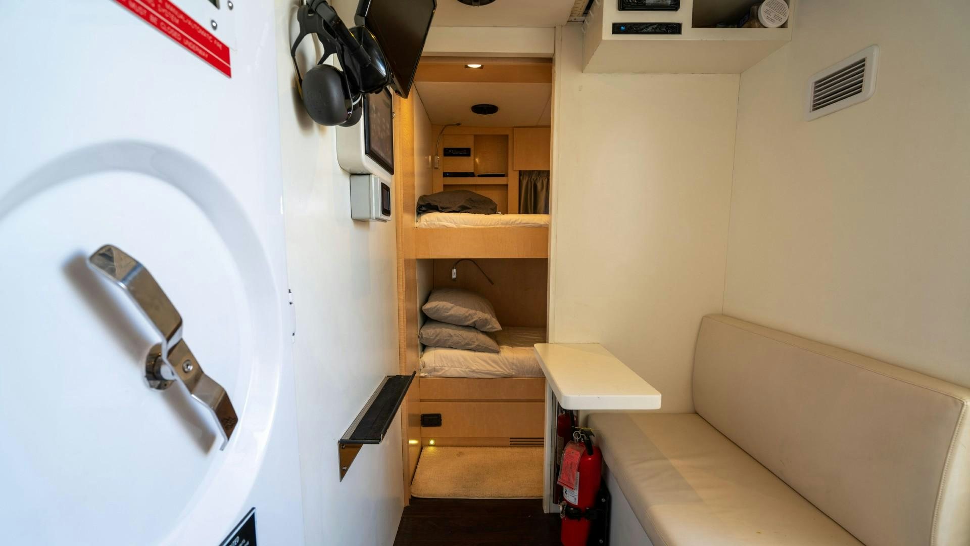 a room with a bed and a desk aboard PHOENIX Yacht for Sale