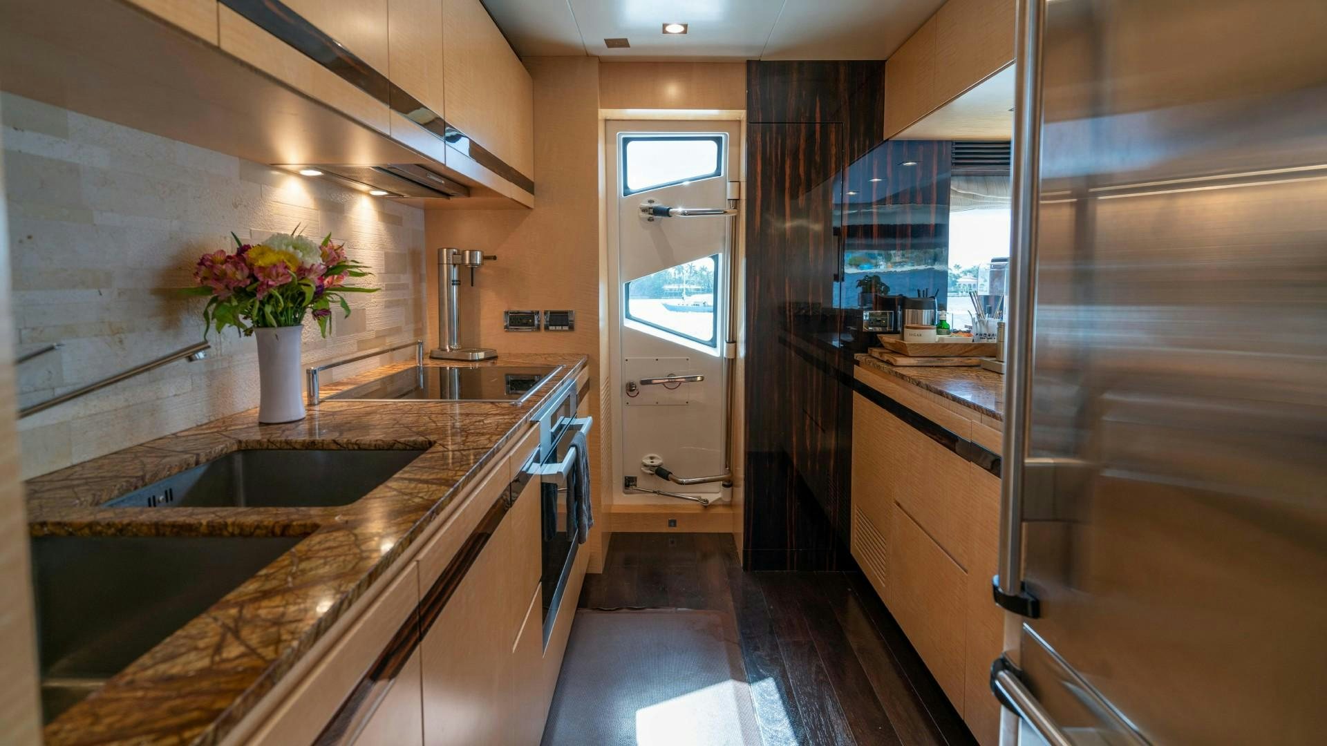 a kitchen with a large countertop aboard PHOENIX Yacht for Sale
