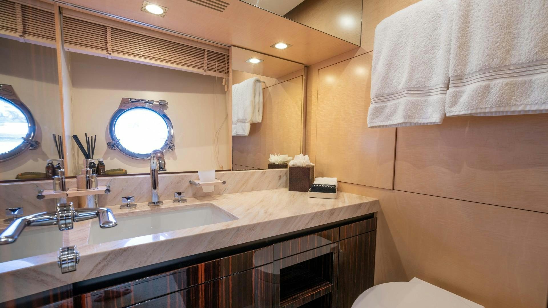 a bathroom with a large mirror aboard PHOENIX Yacht for Sale