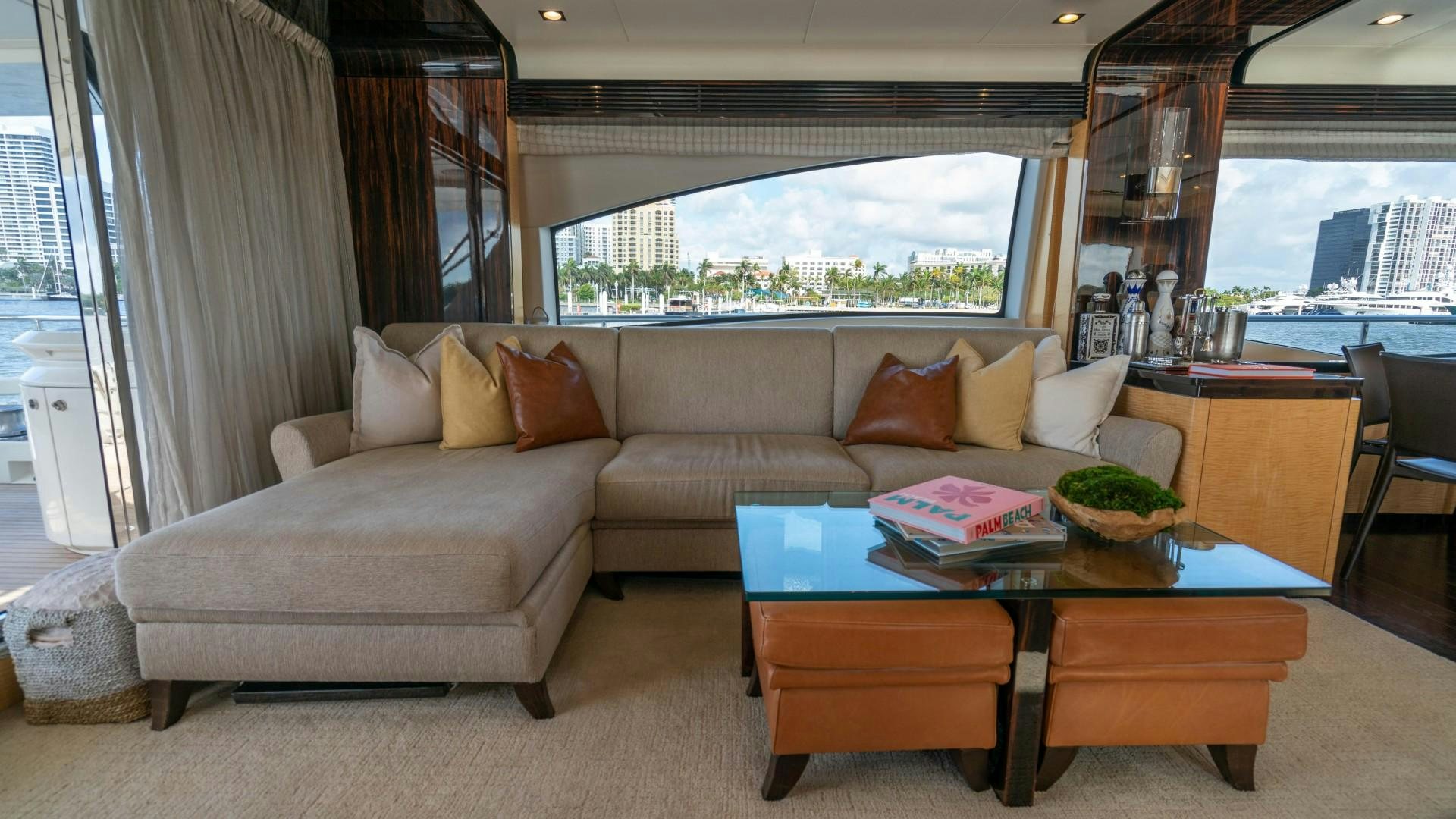 a living room with a couch and a coffee table aboard PHOENIX Yacht for Sale