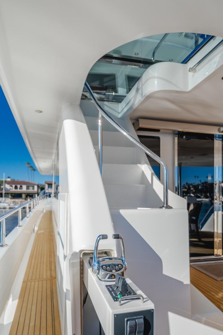 a white boat on a deck aboard OBSESSION Yacht for Sale