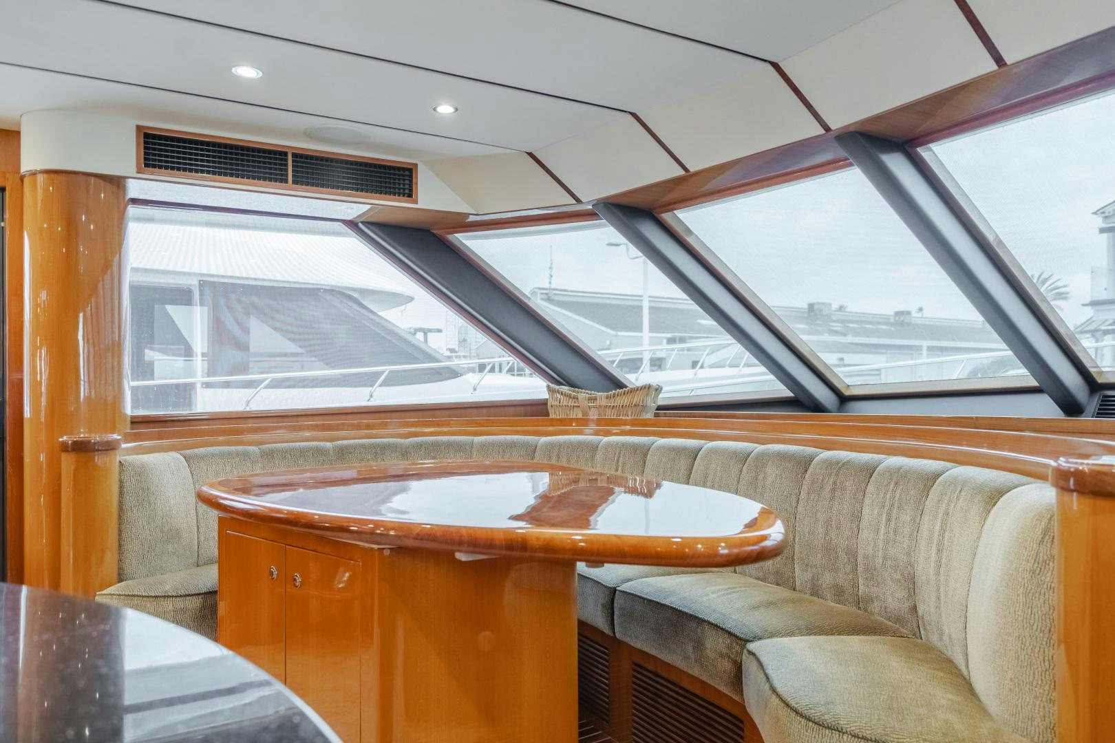 a wooden table in a room aboard OBSESSION Yacht for Sale