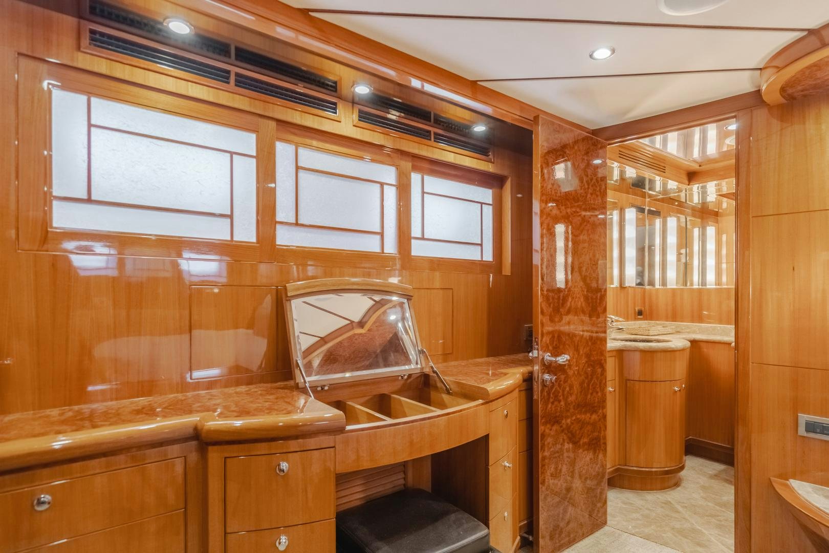 a kitchen with wooden cabinets aboard OBSESSION Yacht for Sale