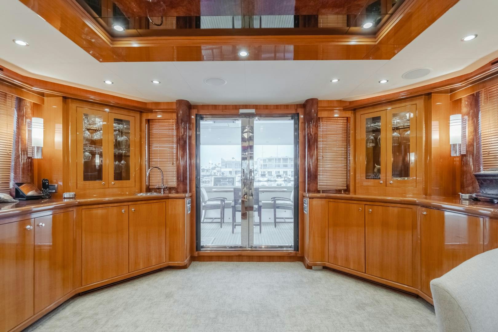 a large kitchen with wooden cabinets aboard OBSESSION Yacht for Sale