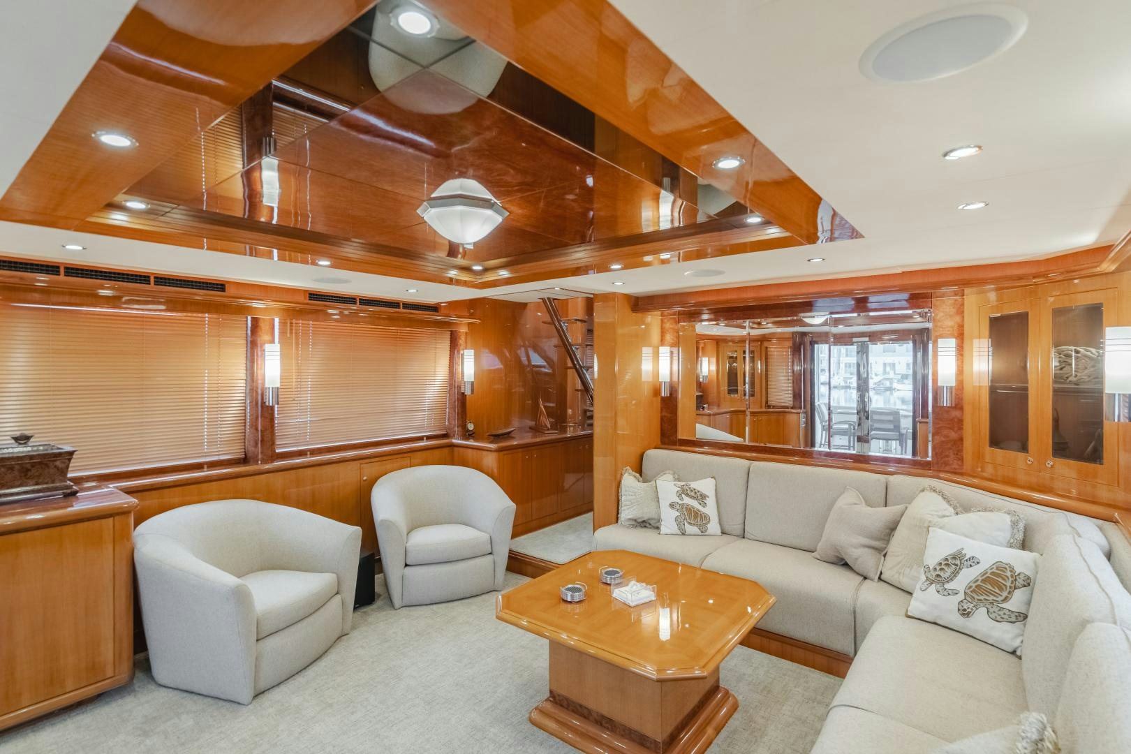 a living room with wood floors aboard OBSESSION Yacht for Sale