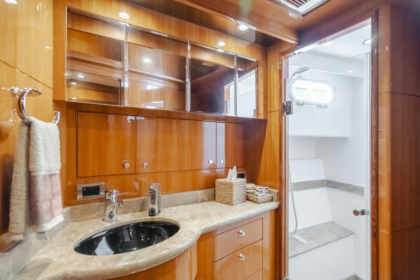 a bathroom with a sink and a mirror aboard OBSESSION Yacht for Sale