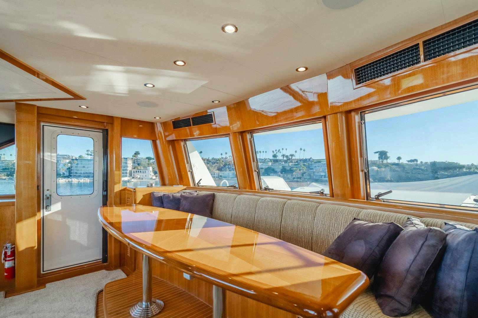 a living room with a large window aboard OBSESSION Yacht for Sale
