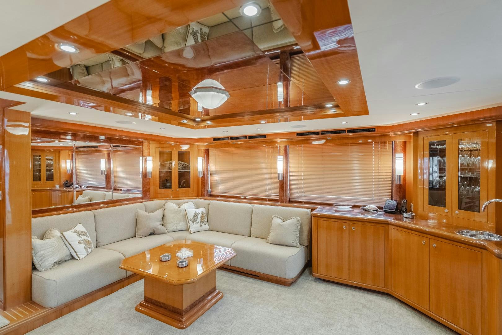 a living room with a couch and a table aboard OBSESSION Yacht for Sale